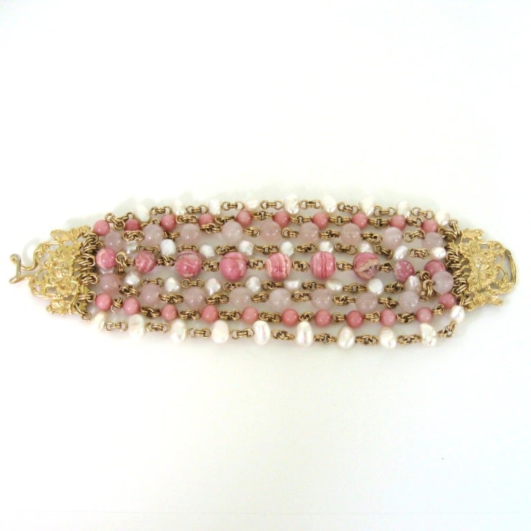 Exquisite Multi-Strand Stone Bracelet from famed, award-winning jewelry designer, Stephen Dweck. Pearl Rhodocrosite, Rose Quartz, Rhodinite, gold vermeil. Floral Clasp, New With Tags. 8” end to end.. Will fit a 6.25 inch wrist nicely 6.5 snug.