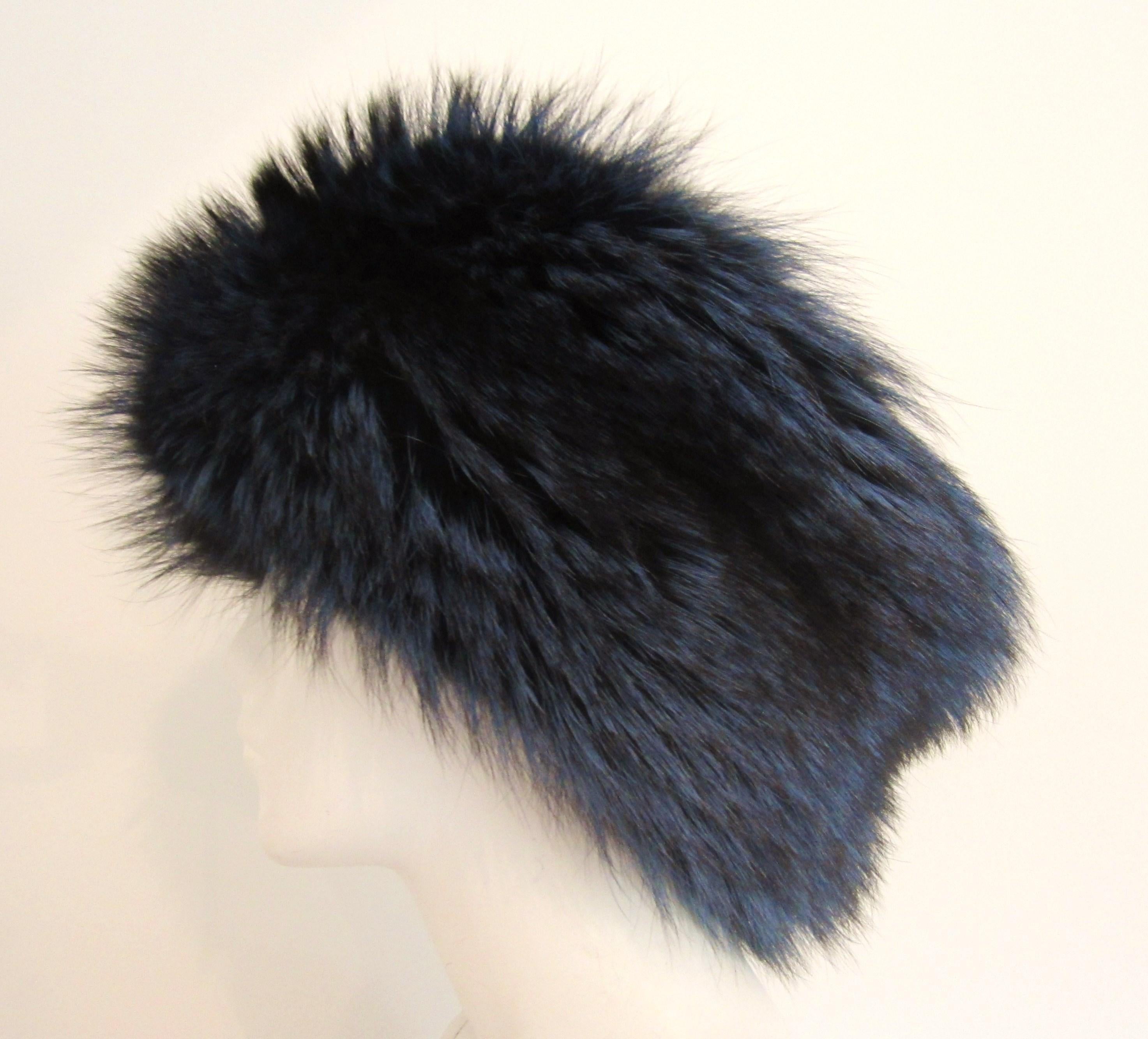 We have some amazing hats up this week! Here is a blue fox & Leather hat. Again seems to have never been worn. Leather at the top. Soft supple. This is a 22in. It fits me tightly, I wear a 23in.  Please be sure to check our storefront for more furs