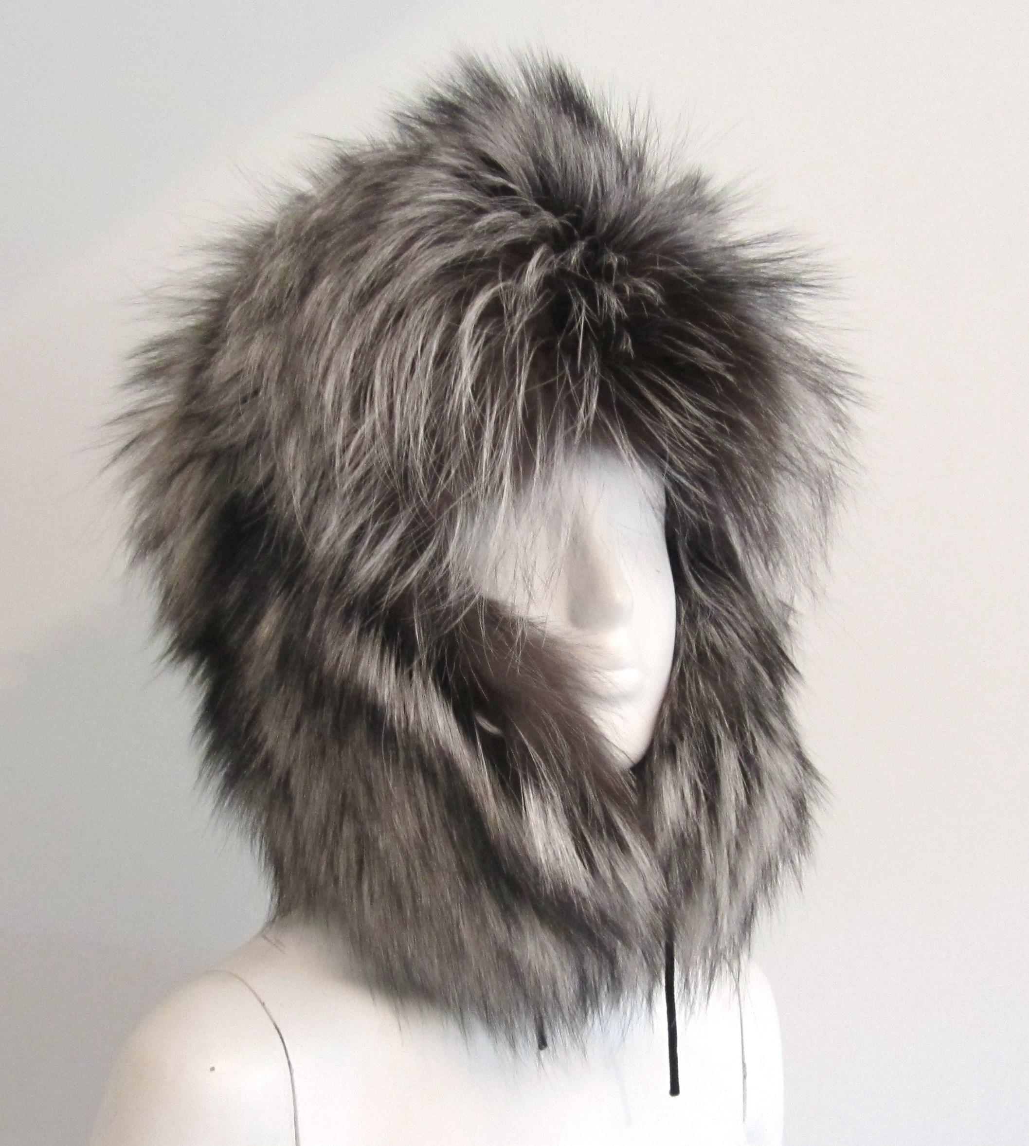 Wonder Silver Fox trapper hat. Ear flaps can be worn up or down for added warmth. Lined.  This is a 23 in hat, as it fits me. There is a pull string on the inside to make it smaller if need be.  Please be sure to check our storefront for more furs