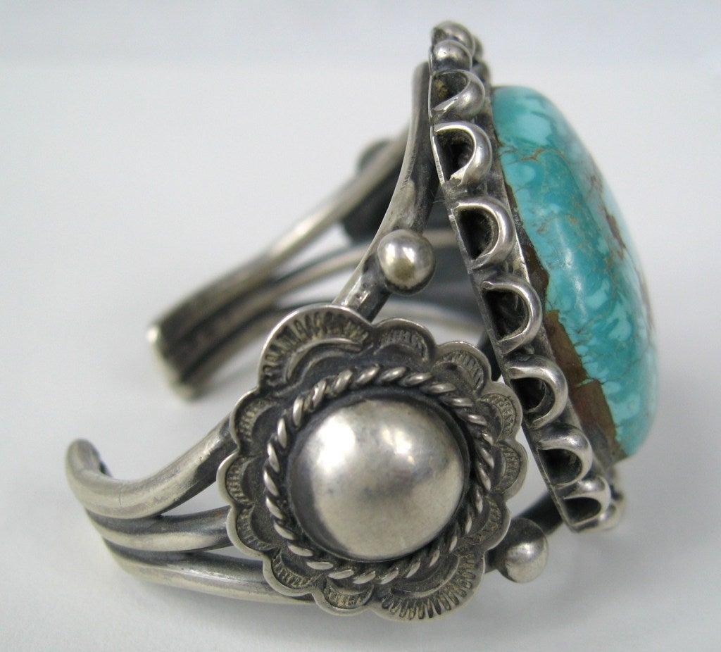 Stunning Southwestern American Indian Cuff. Center Turquoise. Stunning hand made craftsmanship. Will fit a 6 to 6.5 wrist. This is out of a massive collection of Contemporary Fashion as well as  Hopi, Zuni, Navajo, Southwestern, sterling silver,