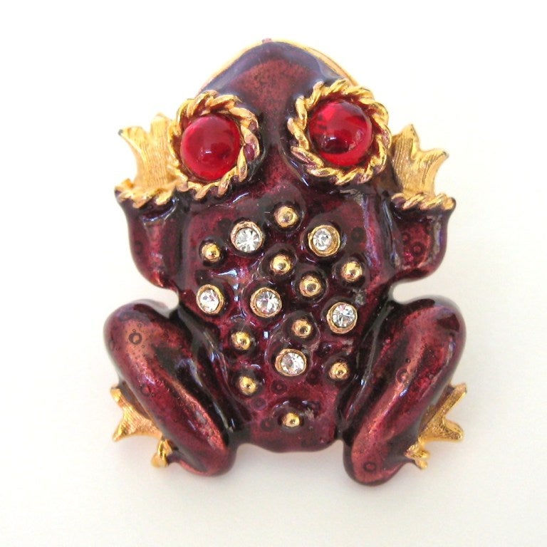 Breathtaking rendition of a jeweled frog Earrings- Clip-On Hallmarked Yosca. They are complete with bulging Red eyes. Classic gold finish Burgundy enamel is encrusted with Swarovski crystals which are used to create spots on the frog.Fine details