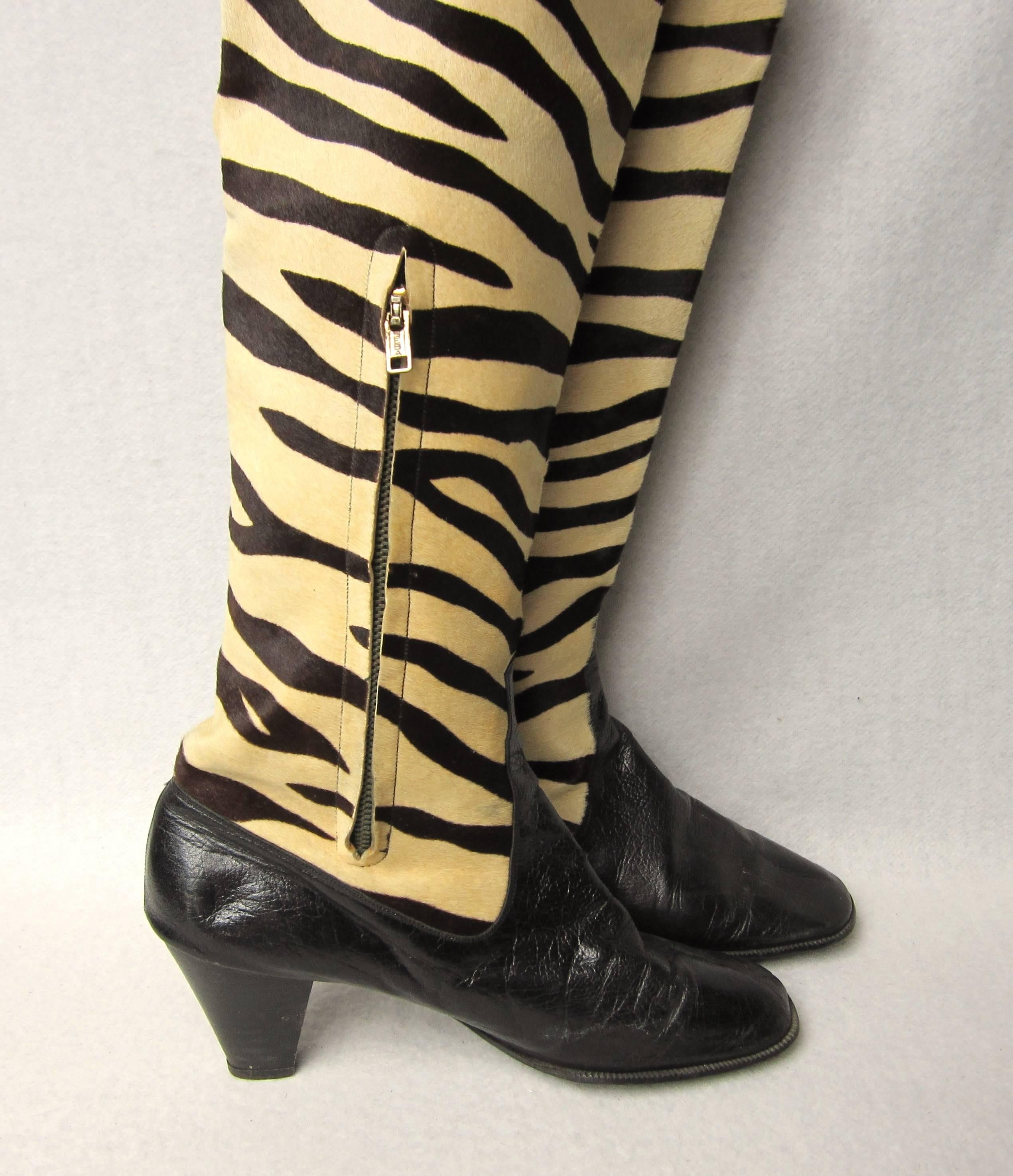 Pair Of Vintage Fur Zebra Print Boots Go-Go Baby! from the 60s to early 1970s. Side zipper working fine. Please refer to the measurements, no size labeled in the boots. 3.25 in.  wide under the sole - 10.5 in.  long toe to heel- 16.25 in. High (