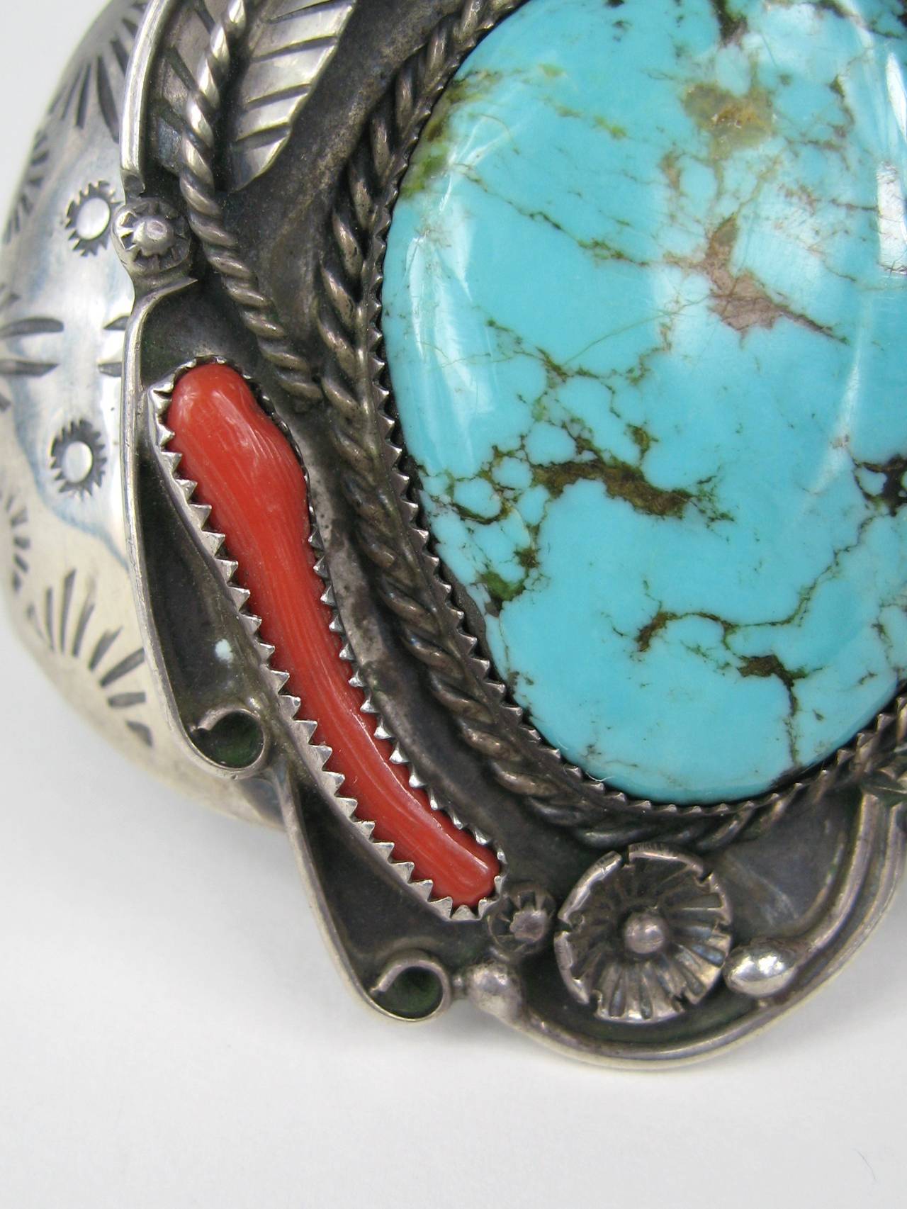 Early Navajo Bracelet, workmanship is outstanding with a Huge Turquoise center with coral accents. Measuring 2.71  top to bottom - 2.08 wide - 1.10  opening, has a bit of give, will fit up to a 7.25 inch wrist. This is out of a massive collection of