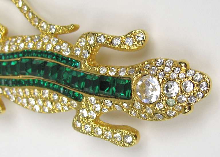 Stunning Green crystal Brooch by Valentino. Gold Gilt. Large in Scale- 4 3/8 in. L  x 2 in. W. This was purchased in the 1990s and stored away, never worn as is about 90% of our costume jewelry we have for sale on our store front. A lot  still have