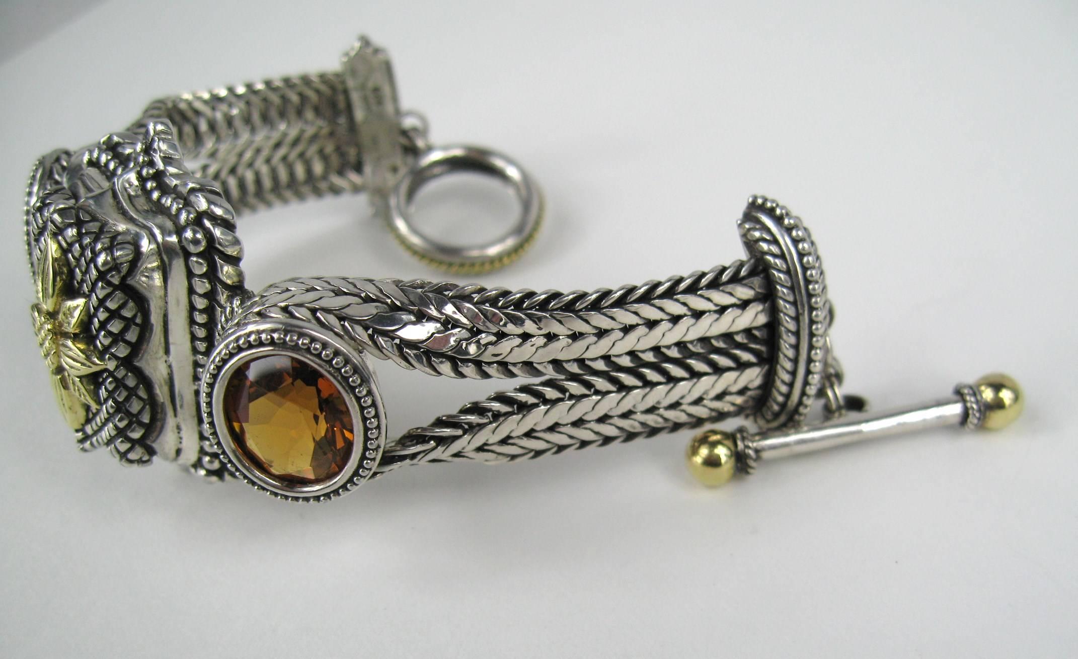 Stunning 1990s  Dweck Bracelet Two large faceted Citrine Stones. Sterling silver & 18K gold detailing. Toggle closure. measuring 1.55  wide. Will fit a size 6-6.5 wrist, we can have it made larger or your jeweler. New Old Stock, never worn. This is
