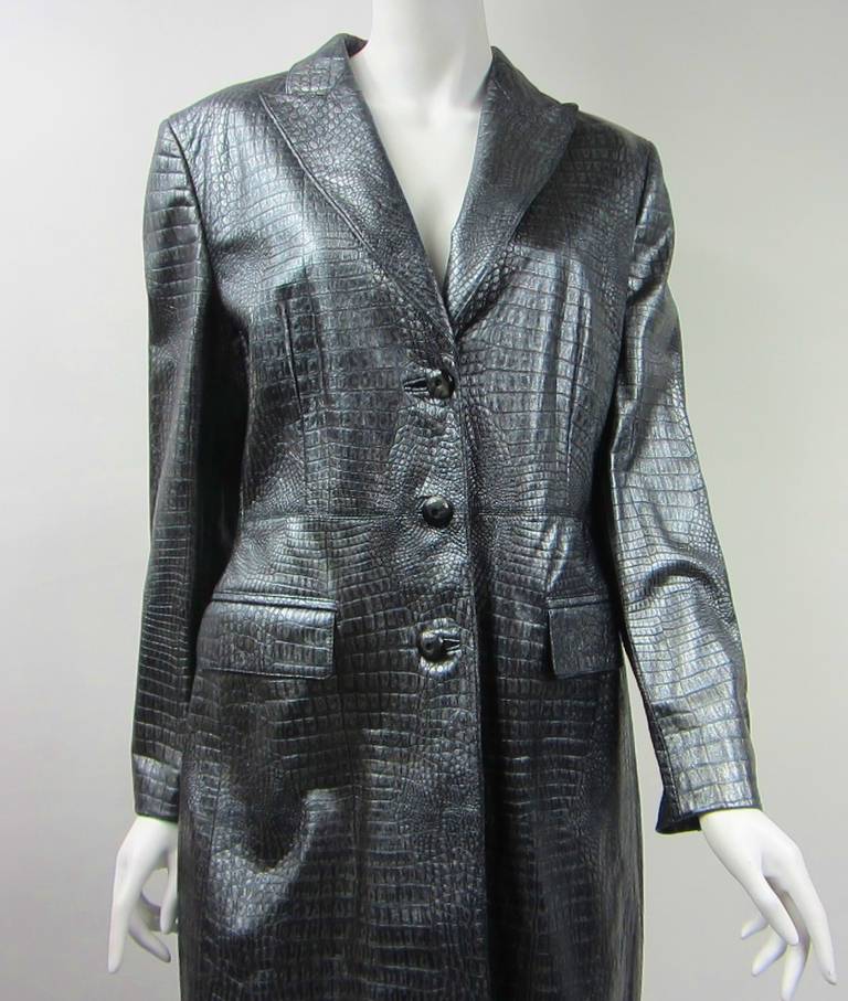 Stunning color on this Escada Leather Jacket. Silver / Gray Metallic Reptile print. New Old stock, never worn. Measuring up to 38 Chest- up to 35 waist up to 40 Hips. 40 length- 23.25 inch sleeve. Be sure to check our store front for more fabulous