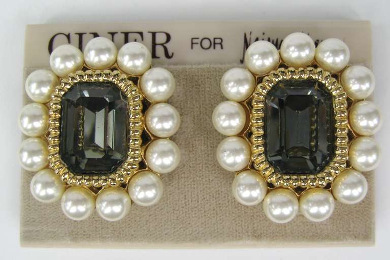 Large swarovski Crystal and Pearl Clip on earrings. New old stock on Neiman Marcus Earring Card. Measures 1.48 inches  x 1.32 inches. The majority of our costume jewelry is New Old Stock from the 1980s early 1990s. This is out of a massive