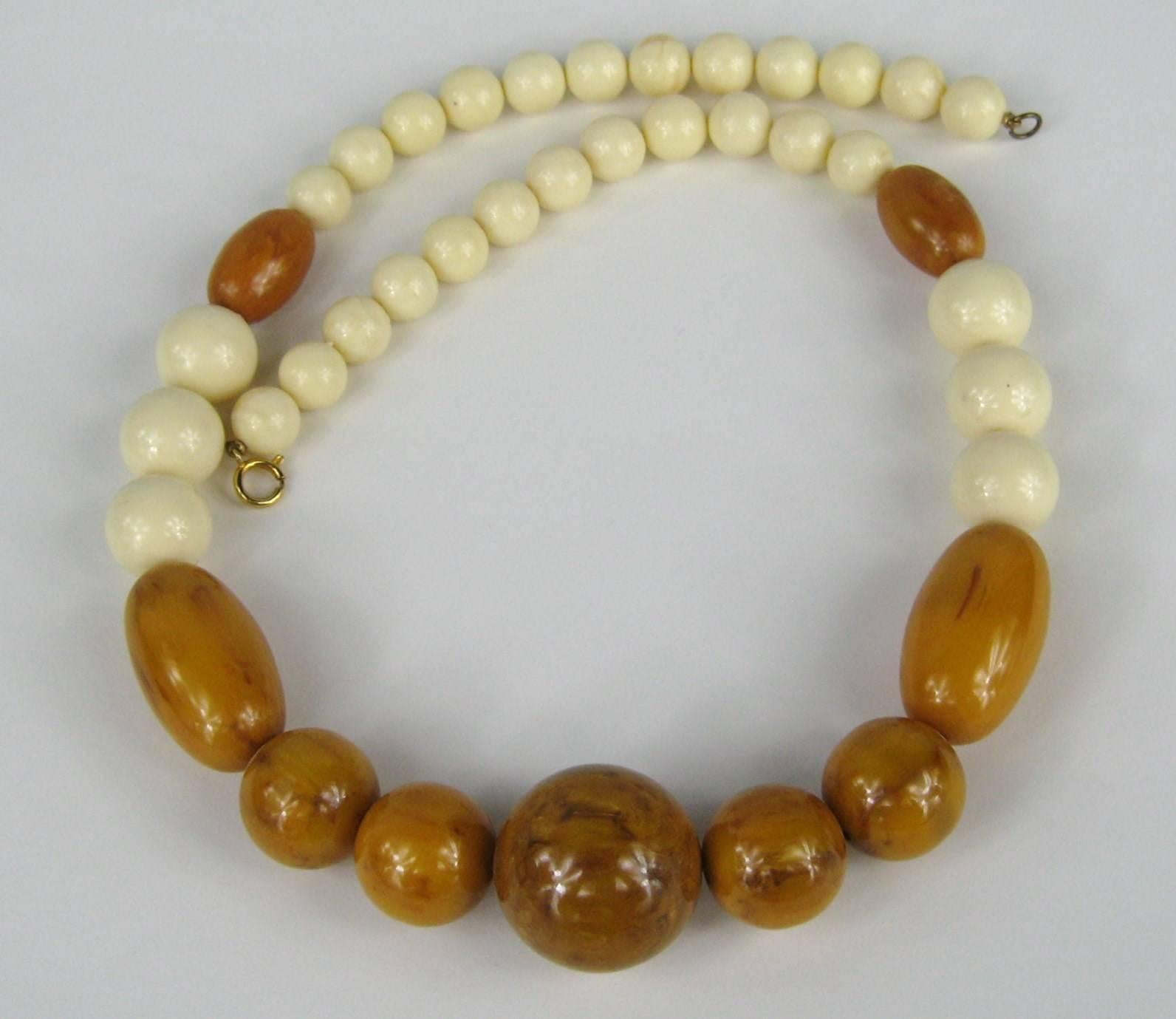 Stunning Swirl Amber Catalin Ball necklace C Clasp. Beads measure 30.95mm down to 11.95 Mix of materials. True vintage Bakelite. Measuring 25 inches end to end.  This is out of a massive collection of Hopi, Zuni, Navajo, Southwestern, sterling