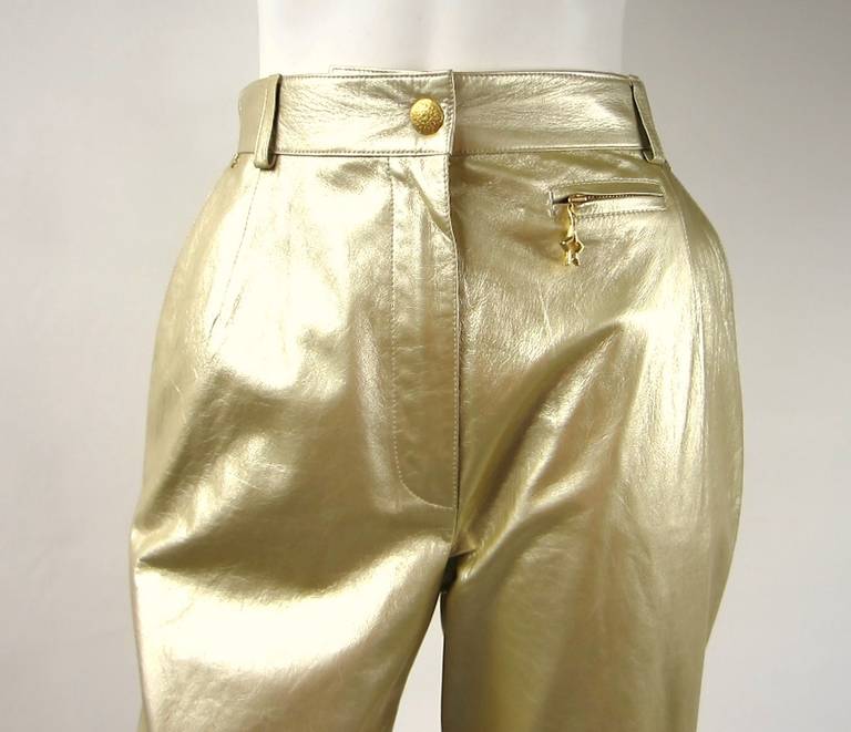 Great Pair of Authentic ESCADA  GOLD Leather Pants. Flat front. Zipper front. Never been worn, still on a Escada Hanger. TAGS STILL ATTACHED. Great star detailing on the pants  Measuring- 30 waist- 38 Hips- 31  Inseam-43 Long. Please be sure to