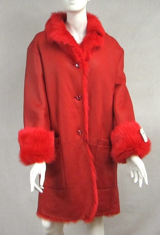 Stunning Red Leather over sized Jacket. Reversible to a Faux fur. Price tag still attached 4000.00. New never worn. Measures. Up to 42 Bust Up to 38 Waist 25.5 Sleeve Size 10     New Never worn. Please be sure to check our storefront for more