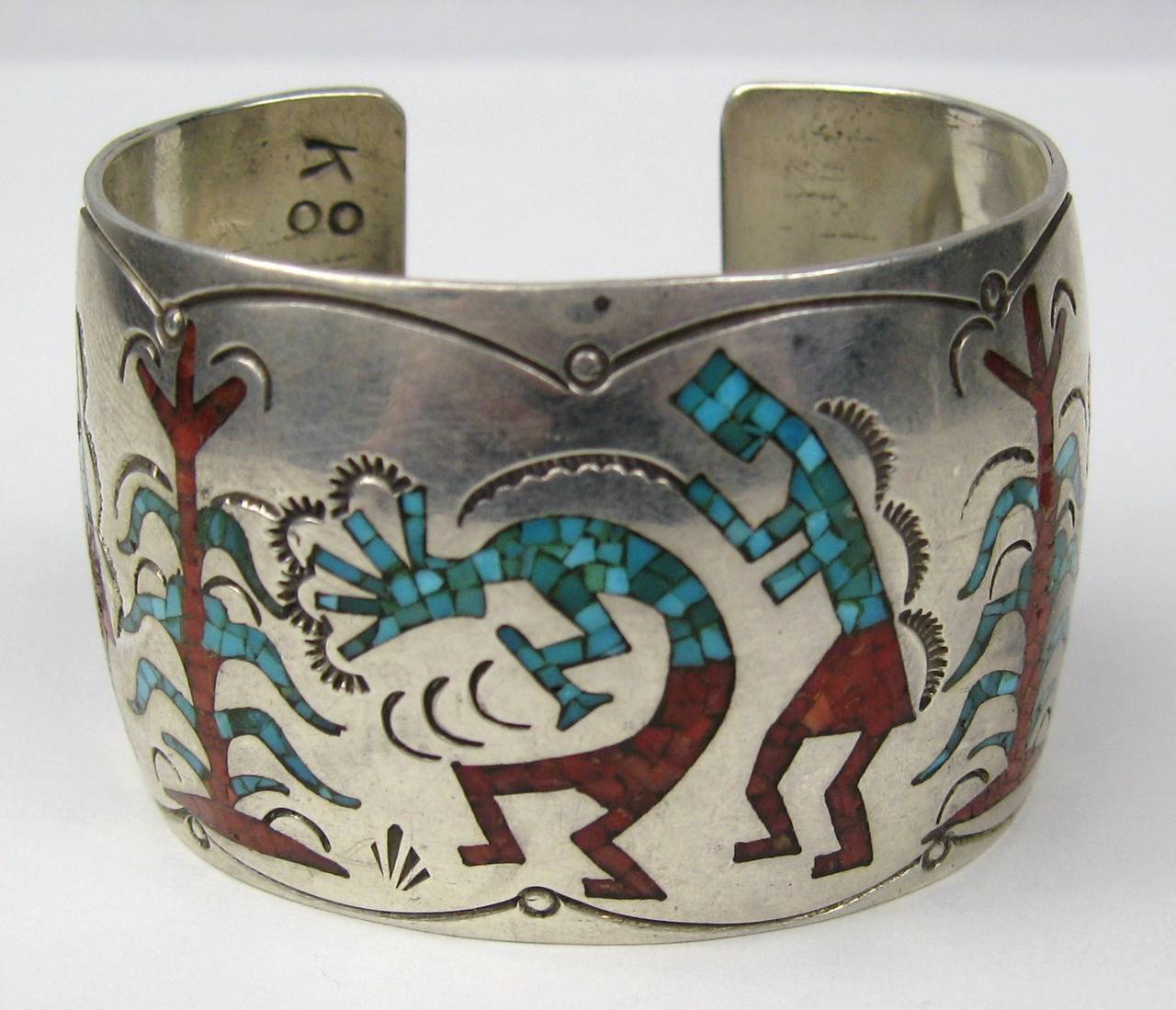 Inlaid Coral and Turquoise native American sterling silver bracelet. Measures 1.57 in wide. Hallmarked inside bracelet. Will fit a 6-7 inch wrist. This is out of a massive collection of Hopi, Zuni, Navajo, Southwestern, sterling silver, (costume