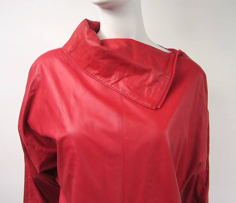 Stunning color Red Michael Hoban for North Beach Leather dress with zippers down the collar to the end of sleeve as well as up the side of the dress Dolman Sleeve. Measures up to a 40 bust- Up to 25 waist - 38.75 long.  Be sure to check our store