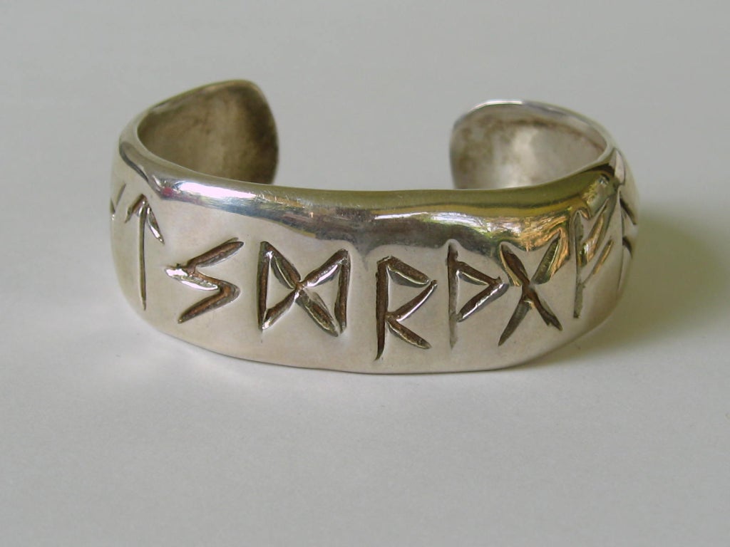 Sterling Silver. Hallmarked RLM. hieroglyphics type lettering around entire bracelet. Cuff is .60 in wide. Will fit a 6 - 7 in wrist. This is out of a massive collection of Hopi, Zuni, Navajo, Southwestern, sterling silver, (costume jewelry that was