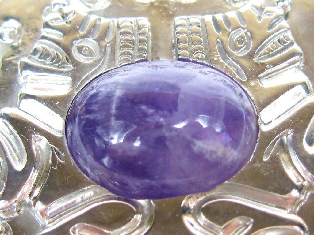 Stunning 1940s Spratling Brooch. Large Amethyst Center Cabochon. Hallmarked on the back dating this to the 1940s. This is a stunning piece of the prized silversmith's work. This is out of a massive collection of Hopi, Zuni, Navajo, Southwestern,