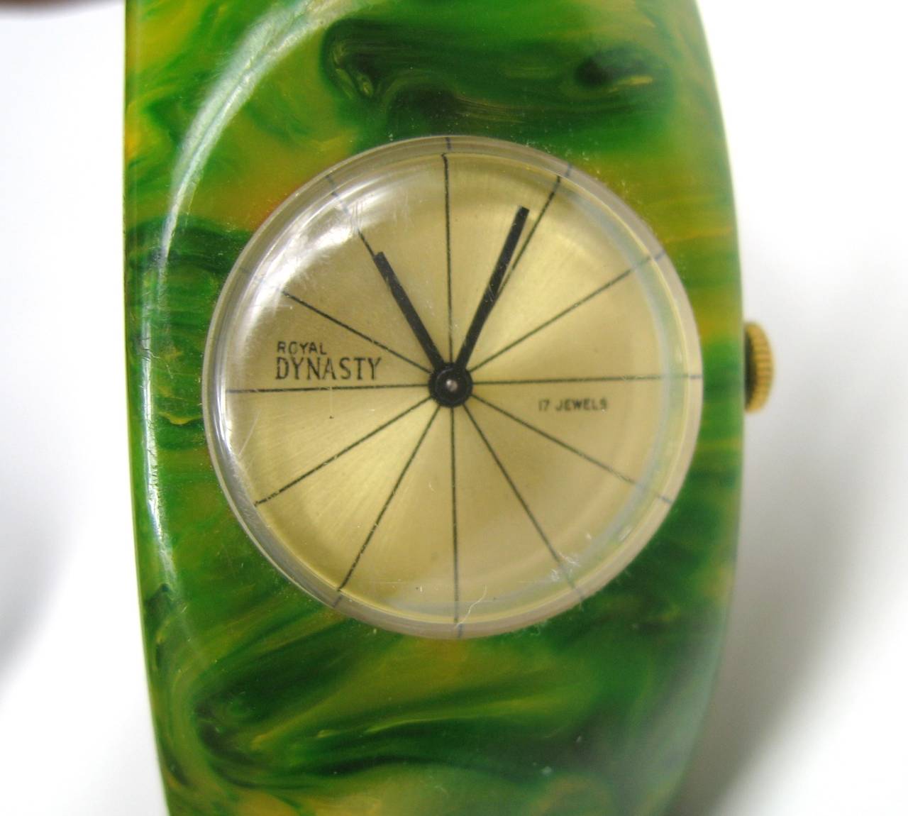 A rare vintage genuine spinach Bakelite / Catalin clamper watch bracelet. There is a hinge that allows the bracelet to open up and slip on your wrist. Royal Dynasty 17 Jewels. watch is working. Measures The inside  measures 2 1/4 inches wide-  band
