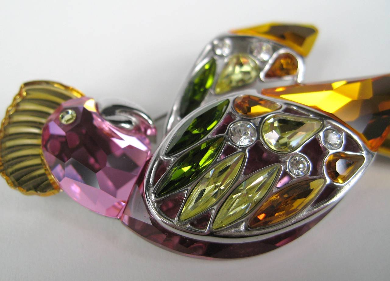 Stunning Amber, lavender, greens and yellow crystals set in sterling silver on this Swarovski Parrot. Great Holiday colors. 3.03 in top to bottom x 1.31 in wide. This is out of a massive collection of Hopi, Zuni, Navajo, Southwestern, sterling