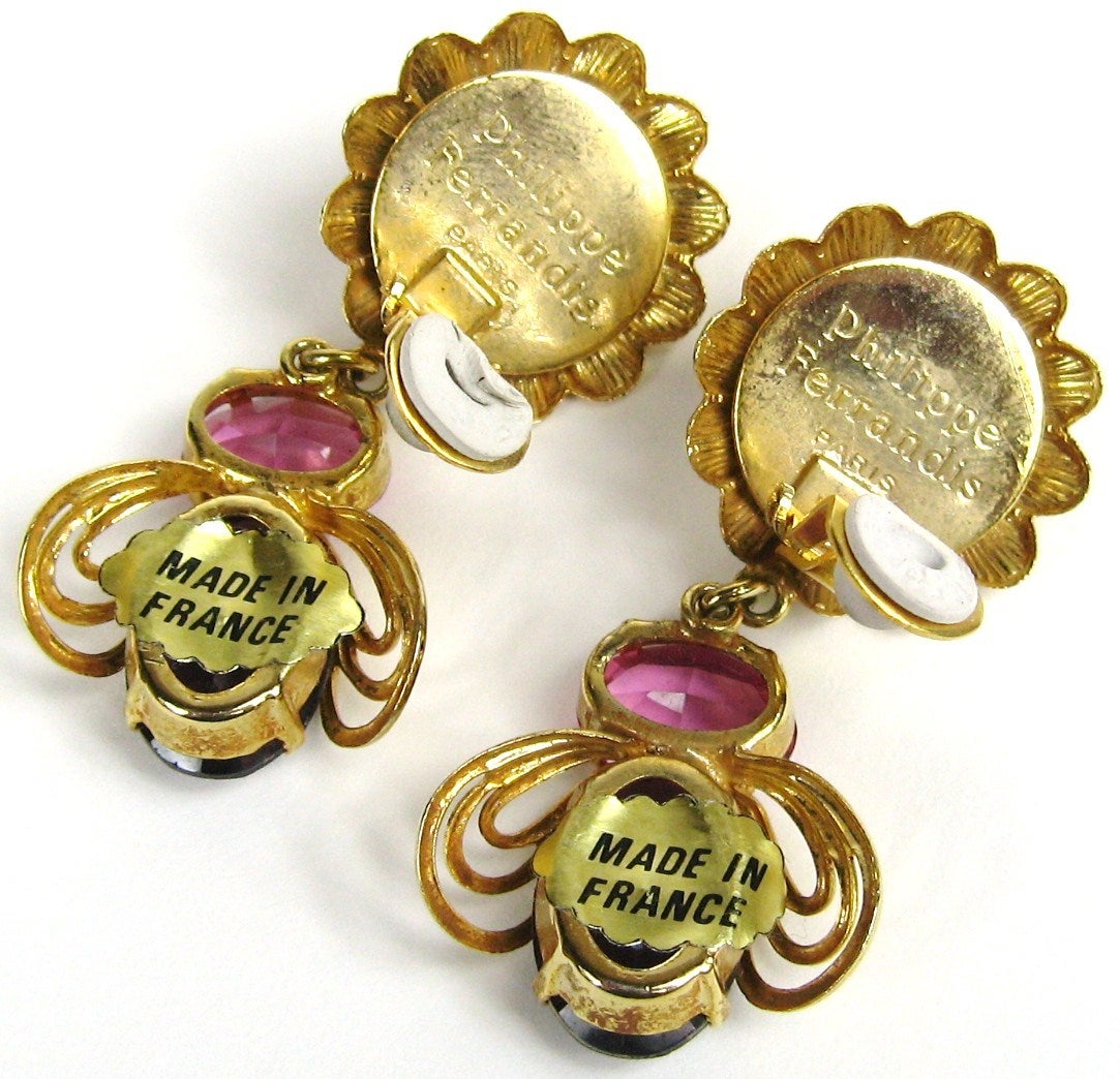 Stunning earrings! New Old Stock from Parisian Artisan Ferrandis. Prong set Pink and Purple Crystal - 2.40 inches long. Please check our storefront for more Ferrandis pieces along with hundreds of designer pieces that are New, never worn from the