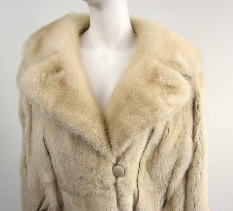 Fab Cream mink Jacket with Original Belt Large Pelt Strips of Mink with leather accent - Mink soft and supple with 2 Slit pockets Measuring 
Up to 46 inch Bust--- Up to 42 inch Waist --- 5.5 Collar--- 23 inch  sleeve -- 35 inch long down the back.
