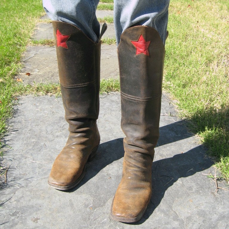 What a great pair Old Vintage Calvary Boots. These boot are thick leather with that great RED star front and center. Large straps to pull them on with. Inside of the boot front is lined with that rich red leather. Men size 11. 16.5 inches up the