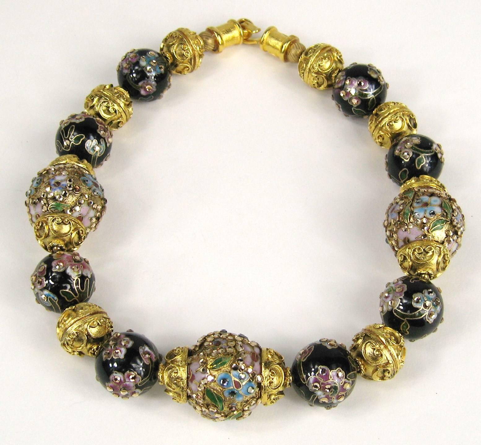 Stunning designer signed Jose & Maria Barrera couture gold plated and ceramic floral statement necklace. Large two tone enameled beads, lovely pastel which a contrasting black bead. Then you have an ornate gold bead. Beads measures 25.97 mm on the