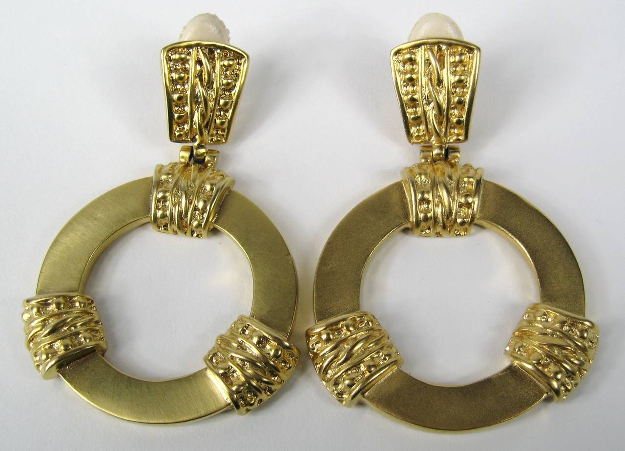 These are a large clip on earrings by Ugo Correani. New old stock, still in the package they came in, Measuring 3.30 long x 2.13 inches wide. Ugo Correani established own label in the 1970's; very closely collaborated with Giani Versace as well as