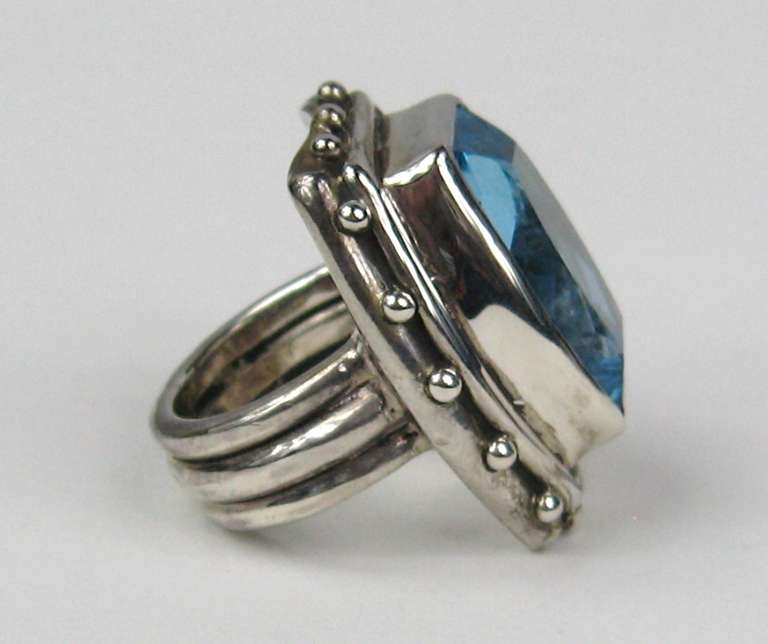 Stunning Blue Topaz set in Sterling Silver made by famed Stephen Dweck. Large stone measuring approximately .83 top to bottom x .67 wide - 1.14 top to bottom  x 95  wide. The ring is a 6.5. This is out of our massive collection of Hopi, Zuni,