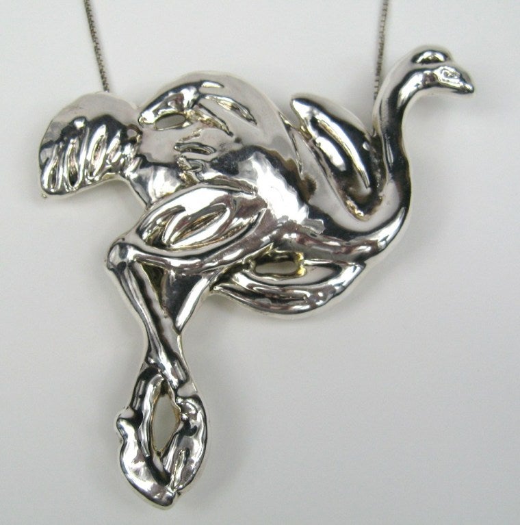 This one is large! Either an Ostrich or Flamingo. Does double duty, pendant as well as a brooch Measures 4.90 inches top to bottom x 3.40 inches wide, Comes with a sterling box link chain that drops it down to 36 inches. This is out of a massive