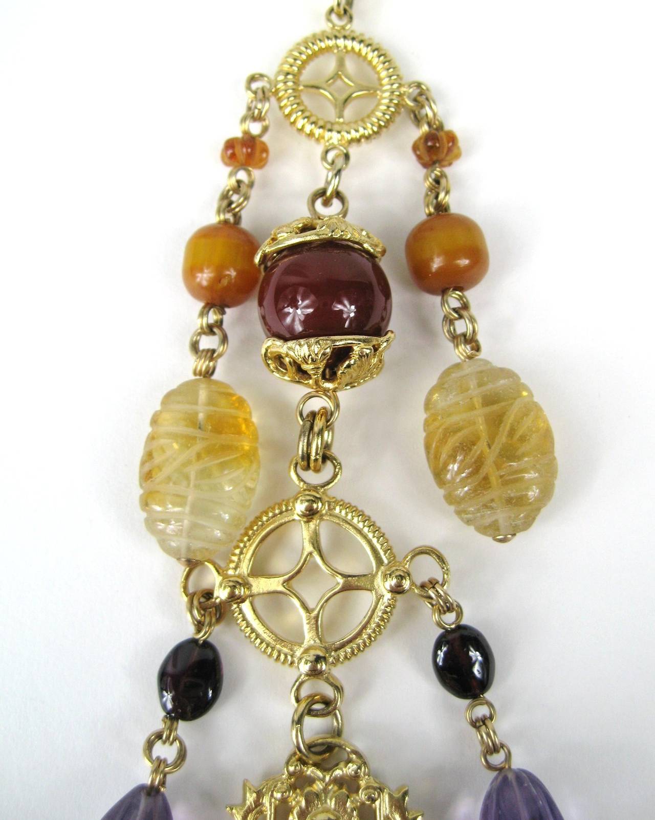 Pictures don't depict how amazing this Stephen Dweck stunning Gold Vermeil over Sterling Silver chain with charms of stones, Amber, Amethyst, Citrine, Garnet, Bloodstone, Horn, Jade and Peridot is! Double link chain Carved Stone - 34-inch long chain