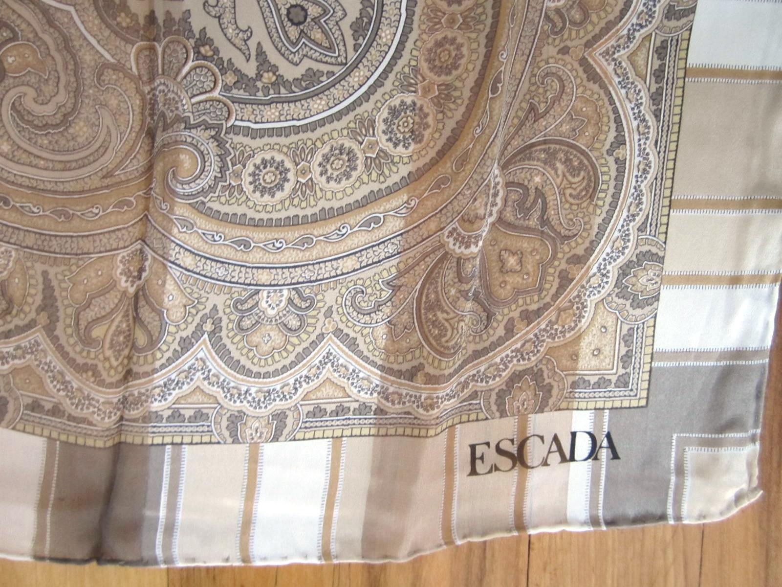 New Never has been worn Silk Paisley Escada scarf.  Original Neiman Marcus tag still attached. This is from a Vast Collection of Scarves that have never been worn Including Gucci and Hermes. Made in Italy. Hand Rolled Silk. This is out of our