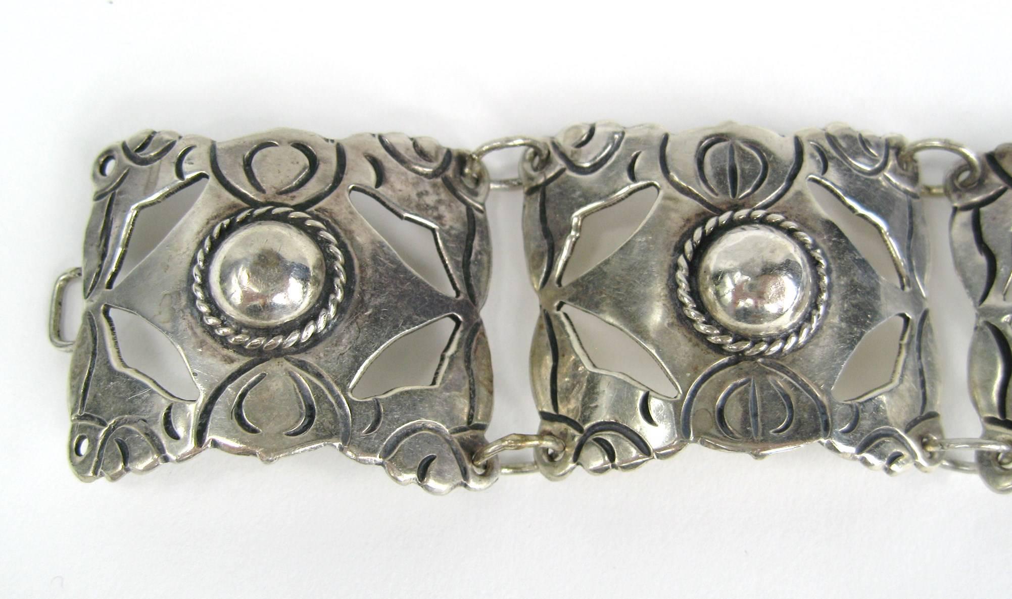Elaborate Mexican Silver Paneled Bracelet. Outstanding craftsmanship on this piece. Hallmarked on clasp. Measuring 1.36 inches wide with 4 panels. Early Mexican Craftsmanship. Measuring approx 7.25 inches end to end. Will fit a 6.5 to 7-inch wrist