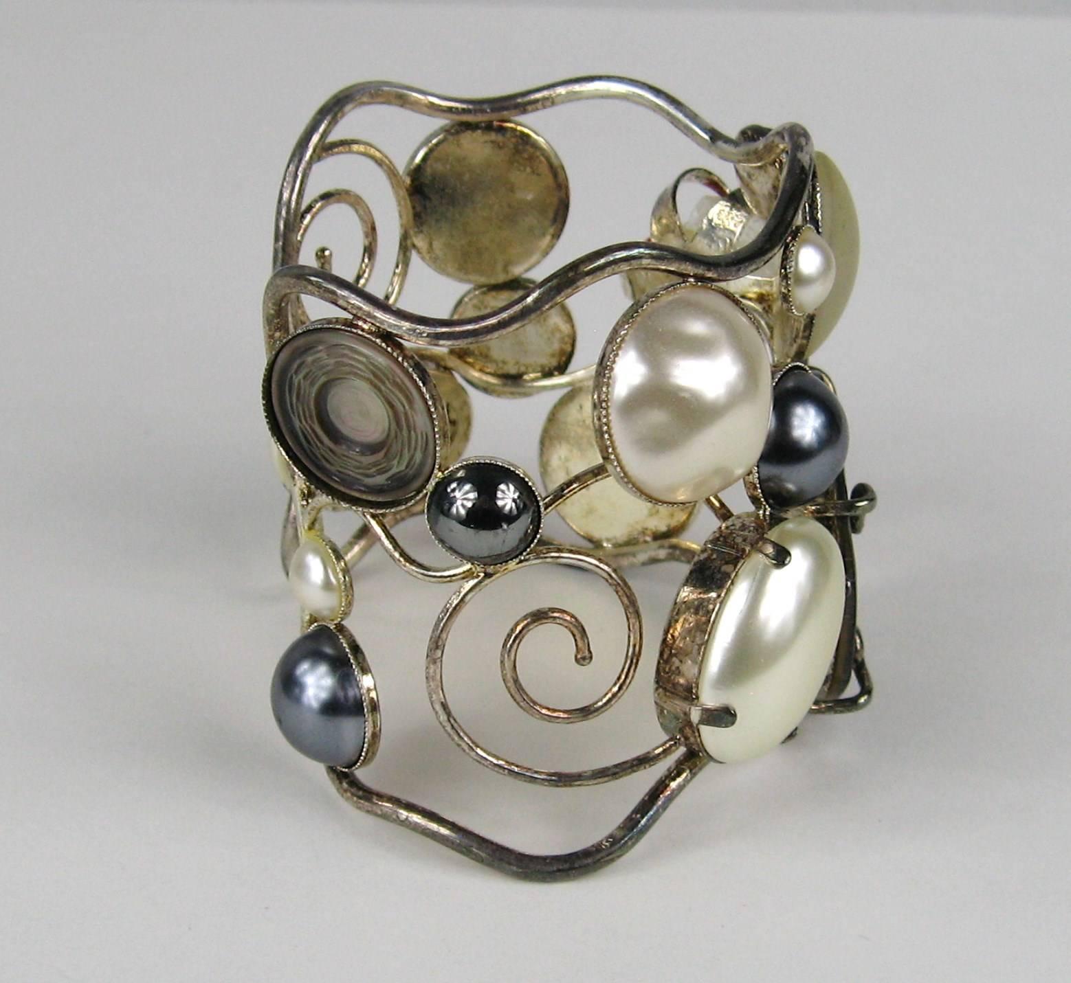 Stunning array of Mabe pearls, crystal and mother of pearl discs. Made in France. Bezel and prong set. Large oversized Cuff. Measuring 2.44 in top to bottom.  Will fit a 6.5 to 7.5 wrist nicely. Can be adjusted a bit larger or smaller. This came