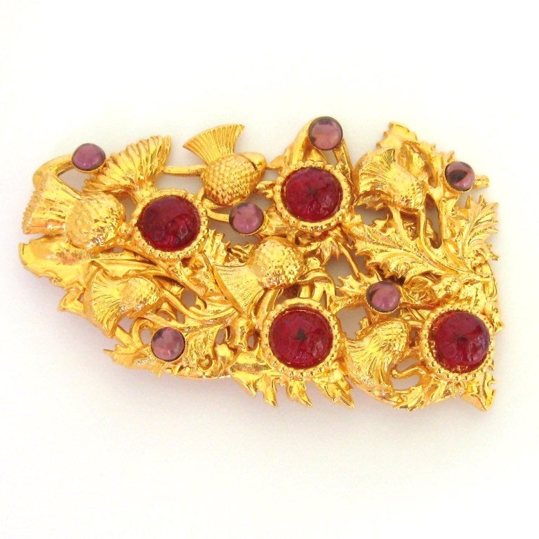Vintage 1980s Dominique Aurientis gilded Brooch with winding vines. Gilded gold bezel set poured glass cabochons with bold colors of berry and purple. what a dynamic design.  Created by famed designer Aurientis.  Measuring 91.44 mm or 3.60 in  x