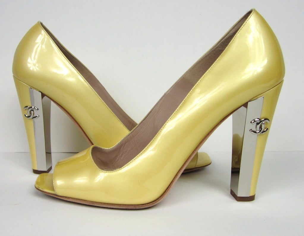 Chanel Pearl Yellow Shoes *Made in Italy. Stunning Silver metal Heels with CC log on each one. Comes with Dust bags. No Box. 39.5 - 4 inch  high heel. Please be sure to check our storefront for more fashion as we have both Vintage and Contemporary