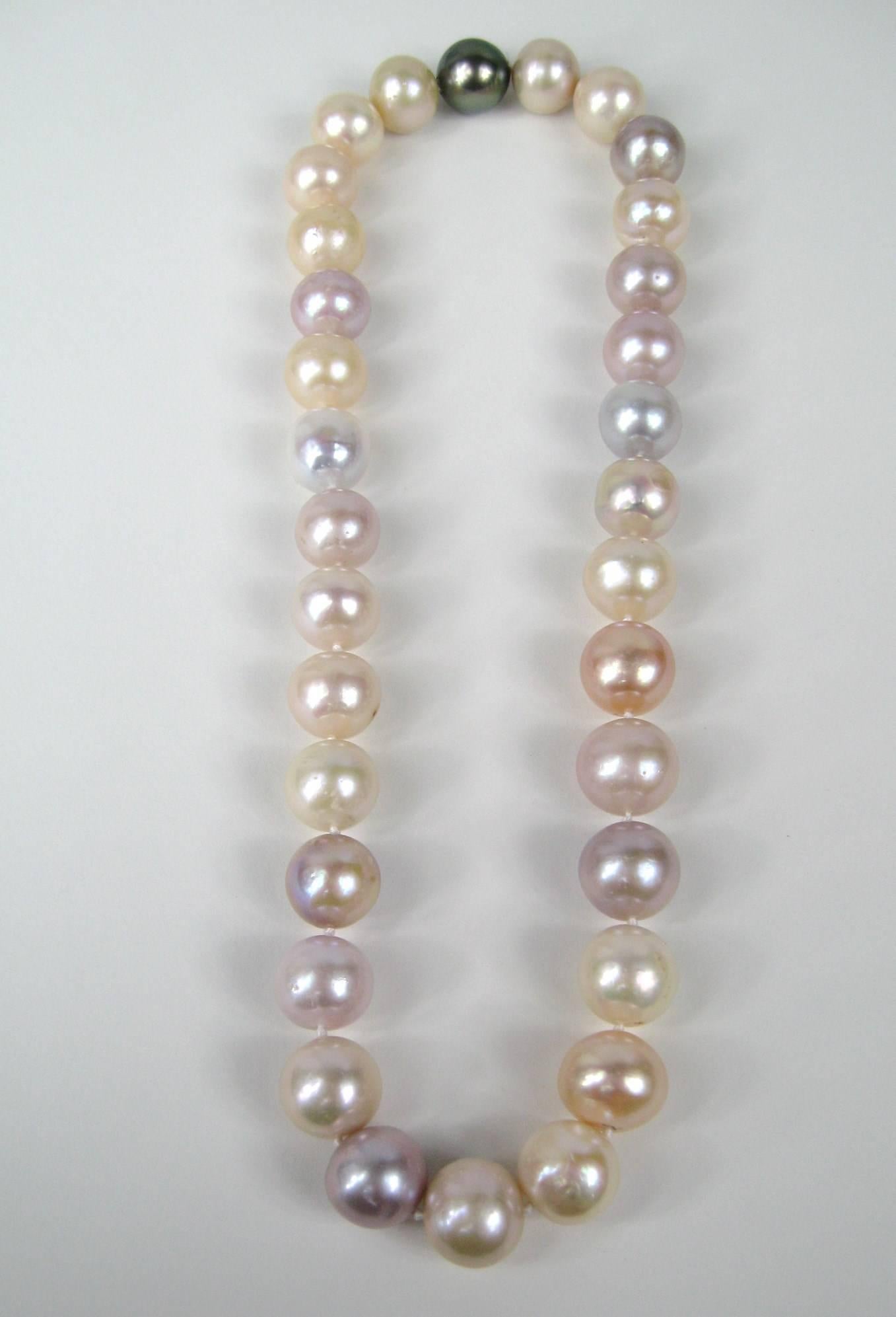 Stunning Large Pearl Choker Necklace. Pearls Measure 12.8 MM. Varying in color. Hidden screw closure where the black Pearl is. Measures 17.25n long end to end. This is out of a massive collection of Hopi, Zuni, Navajo, Southwestern, sterling silver,