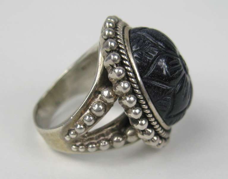 Stephen DWECK new old stock sterling ring. Deep blue with flecks in it. The Tag still with the Ring.  Measures 1in.  top to bottom x .83 in across. Size 6.  Stephen Dweck has long drawn his inspiration from the wealth of materials found in nature.