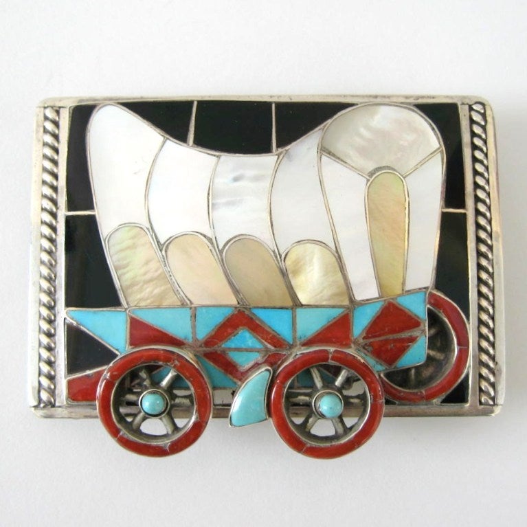 Just stunning. The amount of work that went into this masterpiece is amazing. Covered wagon with movable wheels. Silversmiths, Helen and Lincoln Zunie are masters in their craft and this piece shows you why.  This buckle will accommodate a belt up