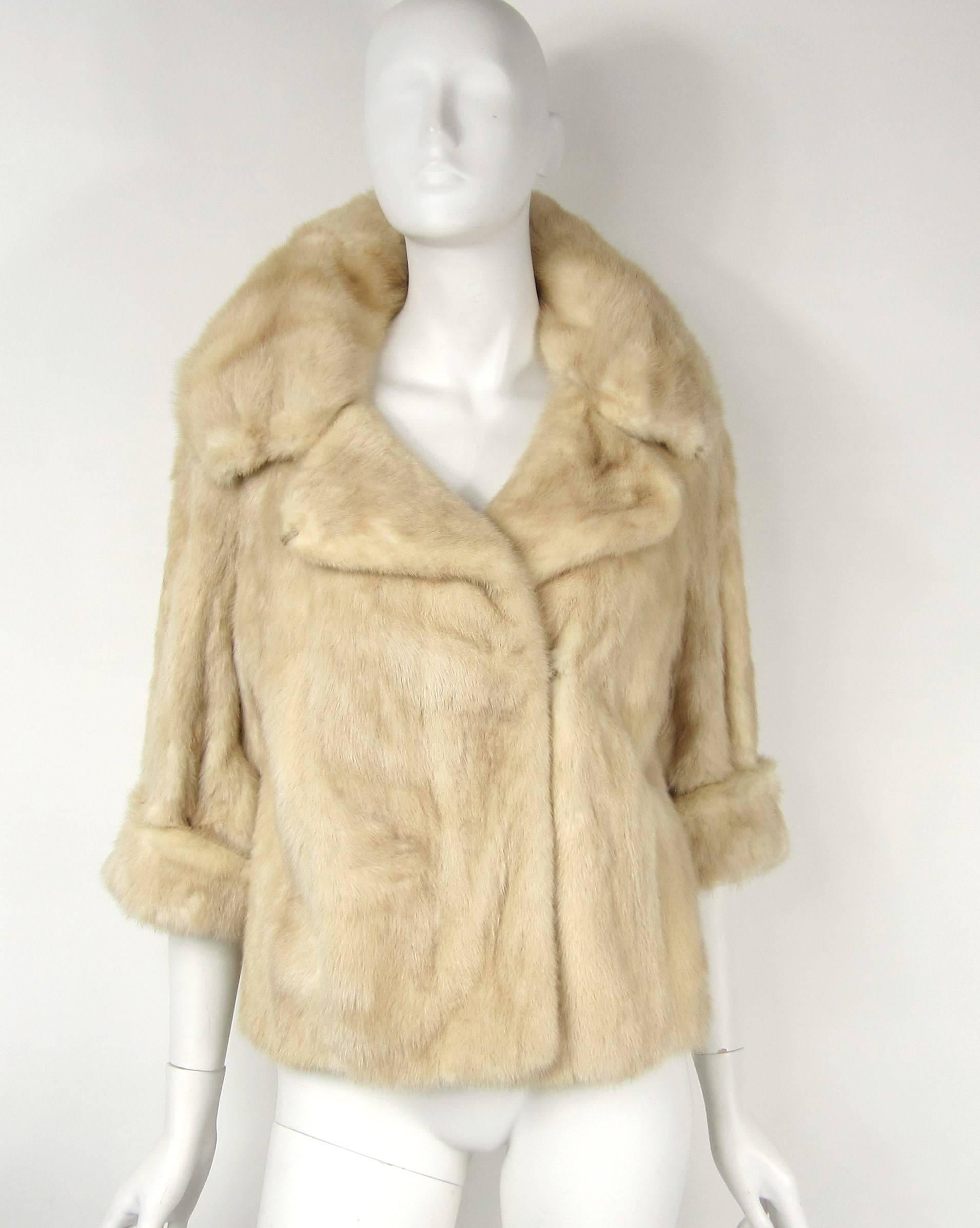 Stunning Cream mink Jacket with a Great wide collar. Bracelet sleeves with cuffs. Slit pockets. Hook and eye closure Measuring Bust up to 39 in, Waist up to 42 in, Collar 6 in, Cuff 3 in, Length 23 in, Will fit a Small - Medium. We have many more