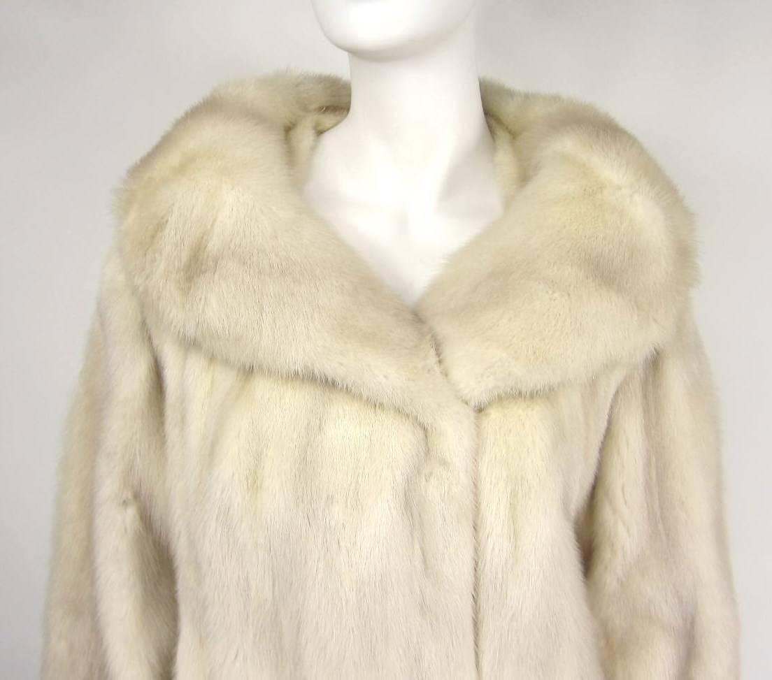 Stunning vintage pearl mink Coat with a Portrait collar - Will fit a 6-10 depending on how much swing you want in the back. Measures- Bust up to 38, Waist up to 42, Hips up to 46 Collar 7.5 in Sleeve 24 in Fur is soft and supple. We have many more