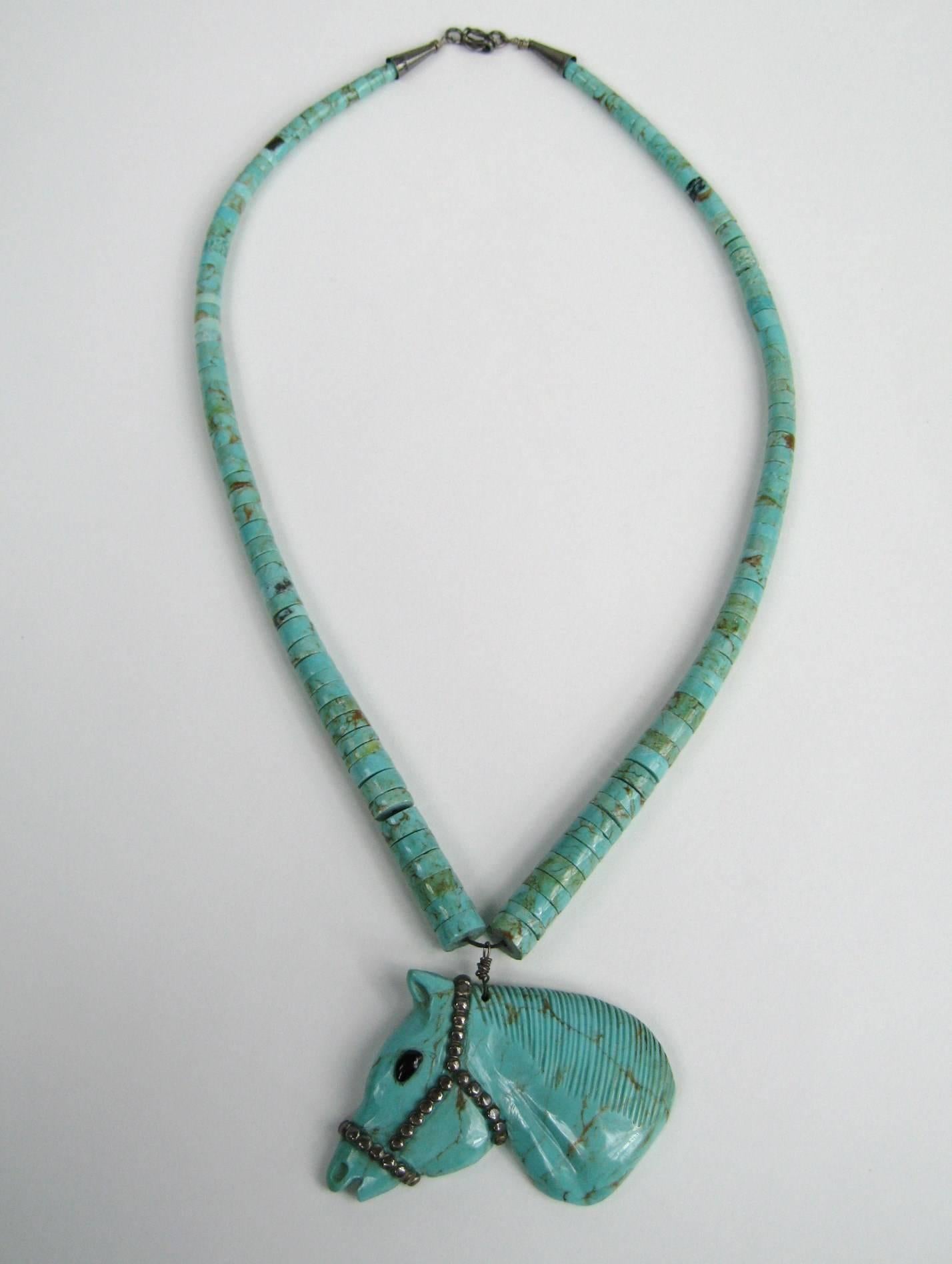 Truly a work of art Carved Turquoise Horse head with an onyx eye- Bridle is made up of Sterling Silver Strung on Turquoise discs. Horse head measures 2.22 inch top to bottom x 2.50 at the widest. Largest disc is .37 x 17 inches graduating down to