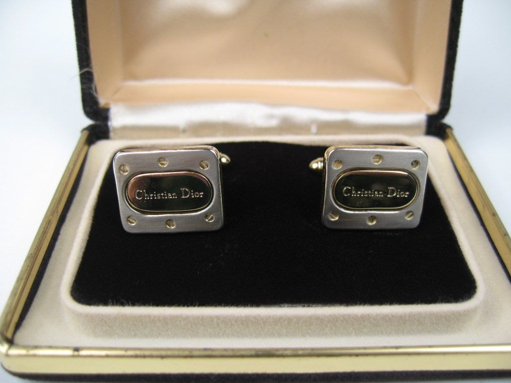 Pair of Christian Dior Cuff links, with the original box. Measuring .65in x .79in. This is out of a massive collection of Hopi, Zuni, Navajo, Southwestern and sterling silver jewelry from one collector. Be sure to check our store front for more