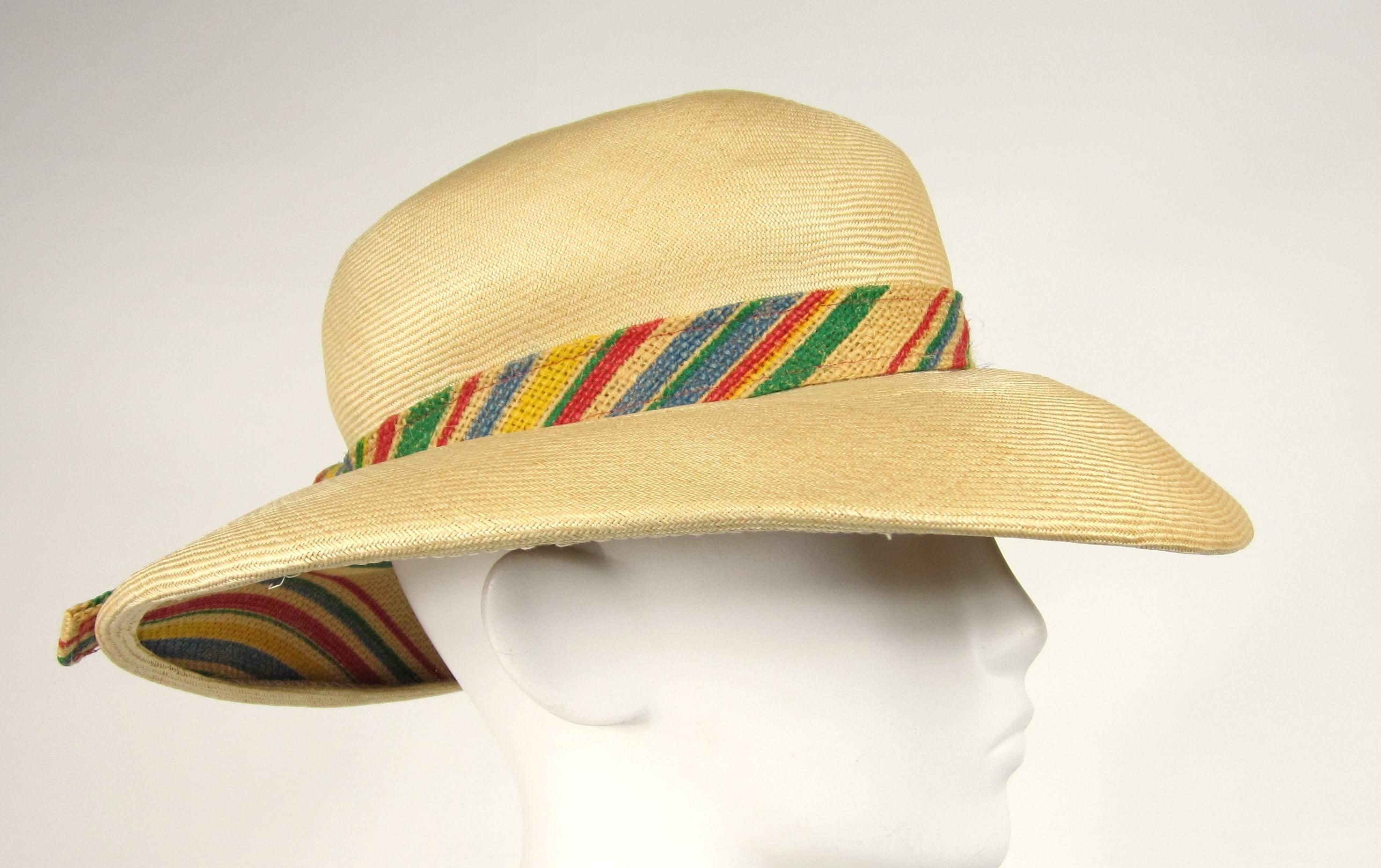 Stunning vintage 1960s Givenchy Hat - Multi Colored Ribbon like detailing surrounding the hat as well as the same coloring on the underside of this treasure. Measuring 22.75 - 4 inch wide Brim - 3.5 inches high. This is out of a massive collection