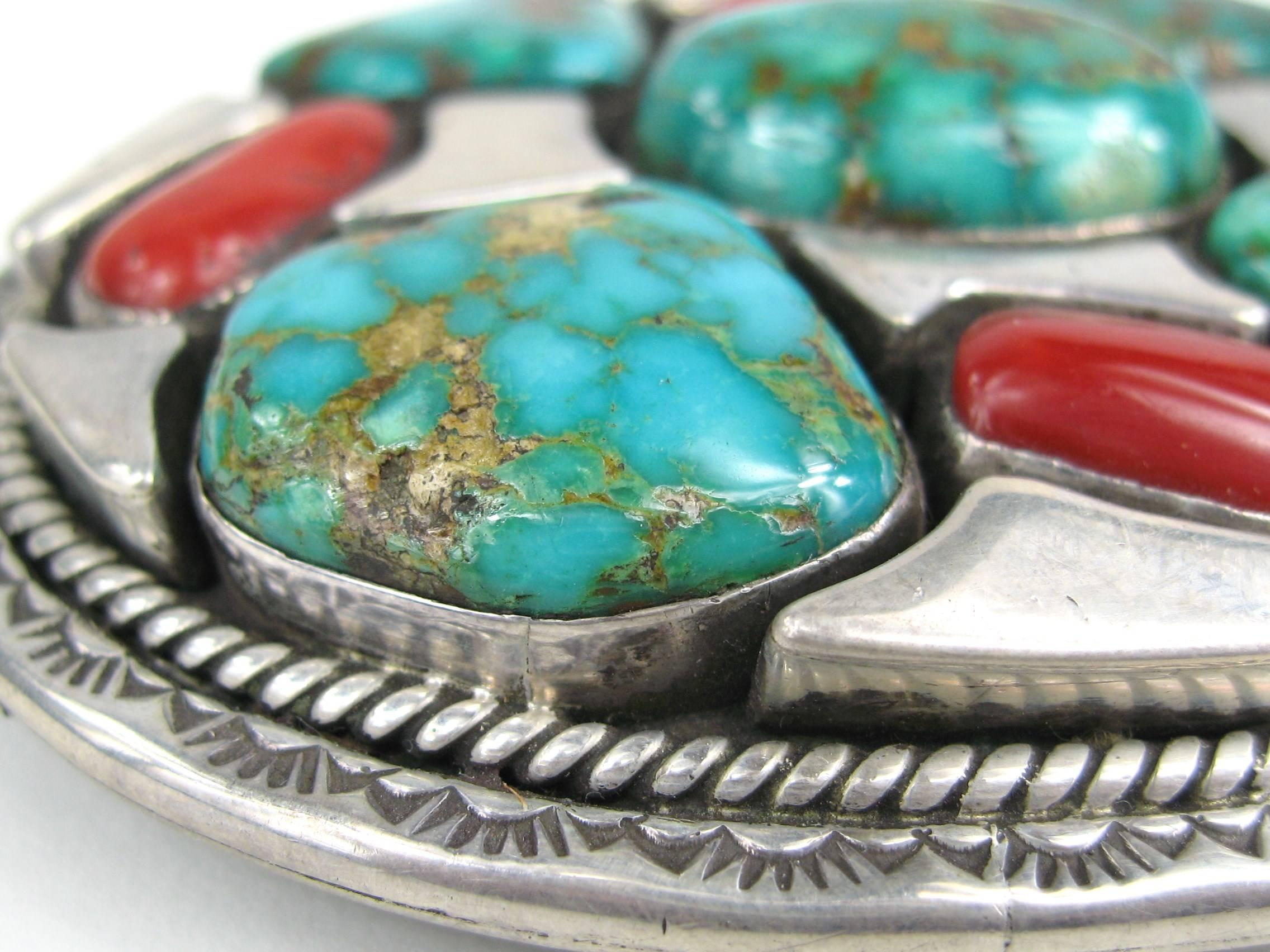 This stunning piece made by Navajo artisan Vandever is made up of huge pieces of Turquoise and coral. This measures 3.53 x 2.88 inches and Hallmarked on the back. This is out of a massive collection of Hopi, Zuni, Navajo, Southwestern and sterling