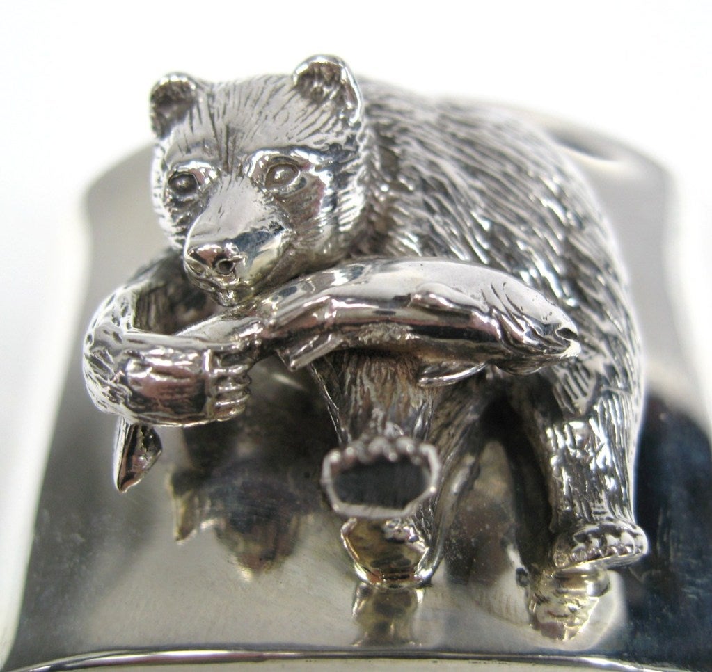 1994 Sterling Silver Wide Cuff Bracelet Depicting a Bear grabbing a fish for brunch! Hallmarked “Carol Felley” measuring.1.65 in wide or 41.9 mm 6 in  circumference 1-1/8 in opening. Carol Felley creates jewelry that expresses her deep connection