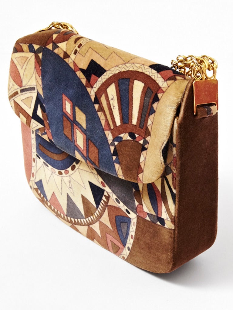 Emilio Pucci, printed, velvet handbag with wide chain handle. Brown leather interior. Shades of rust, beige, and navy blue.
