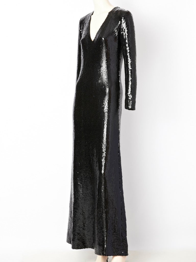 Don Sayres, black, V neck, long sleeve, A line, sequined, evening dress.
Bodice is slim fitting. Simple and chic, inspired by the silhouettes of Halston's designs.