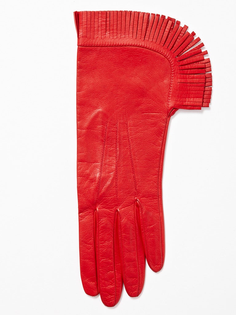 Yves Saint Laurent, red leather gloves with fringed detail at the wrist.