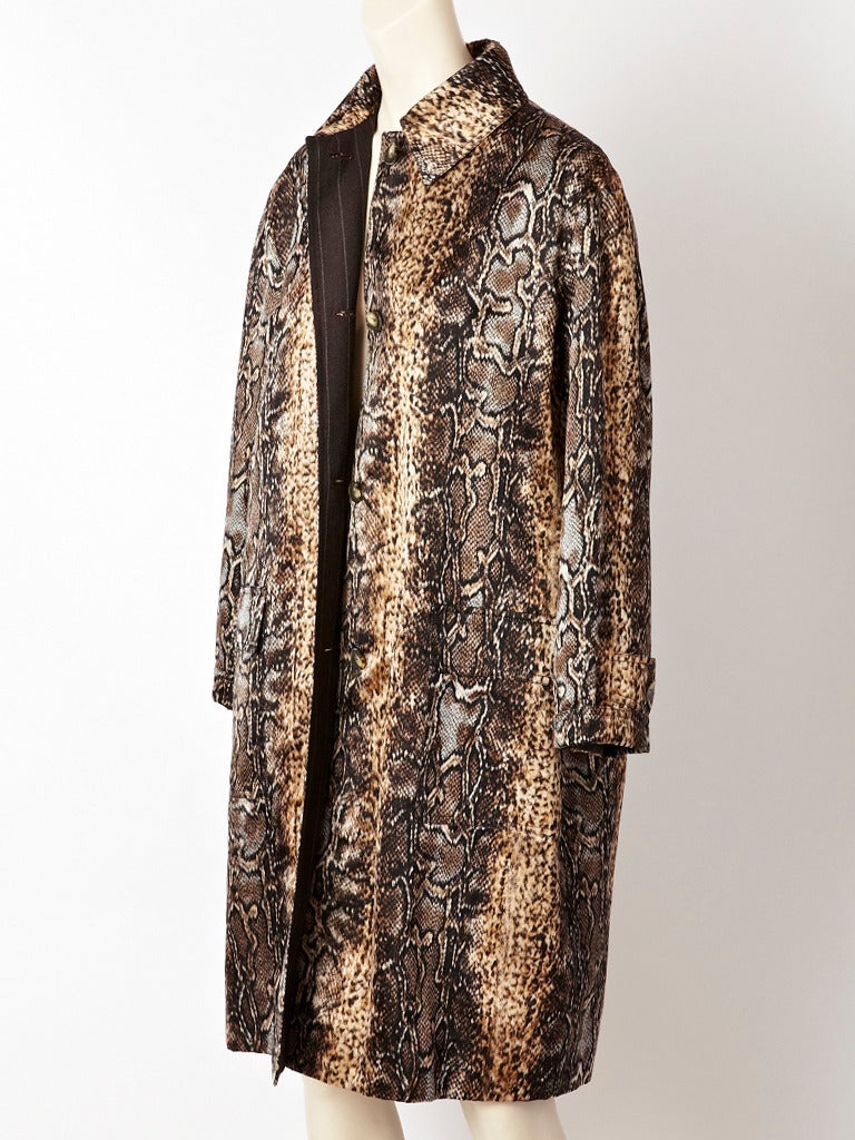 Bill Blass, classic, satin, snakeskin print, mackintosh, style coat with a gray, chalk stripe, wool flannel lining.. Lovely shades of browns and beige.
