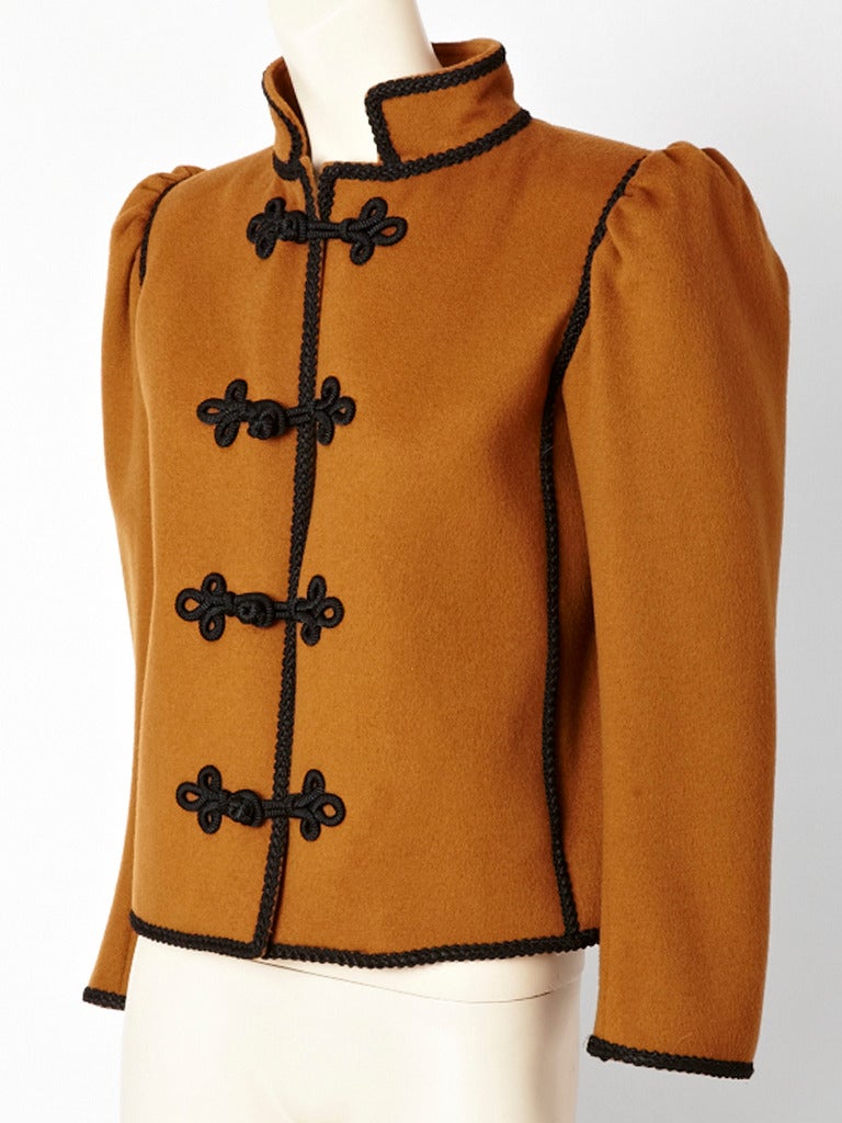 Yves Saint Laurent, cognac color, wool, Russian collection jacket, with puff sleeve, detail, Mandarin collar and black Passementerie trim.