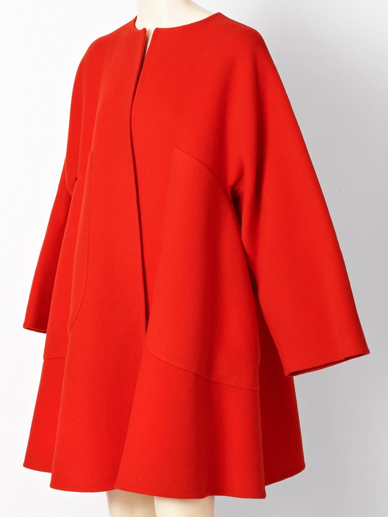 Bill Blass, double face wool, collarless, swing coat with huge patch pocket detail.