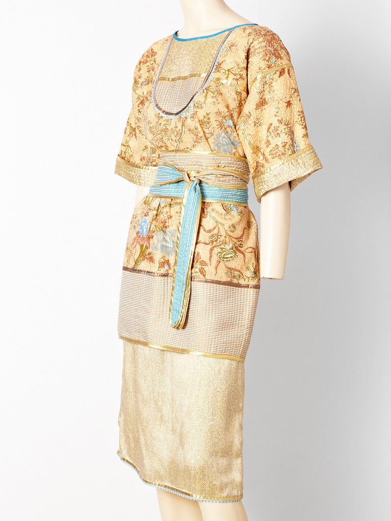 Geoffrey Beene, silk, floral print, peach tone belted ensemble with touches of blue and gold in the details. Tunic top has a 